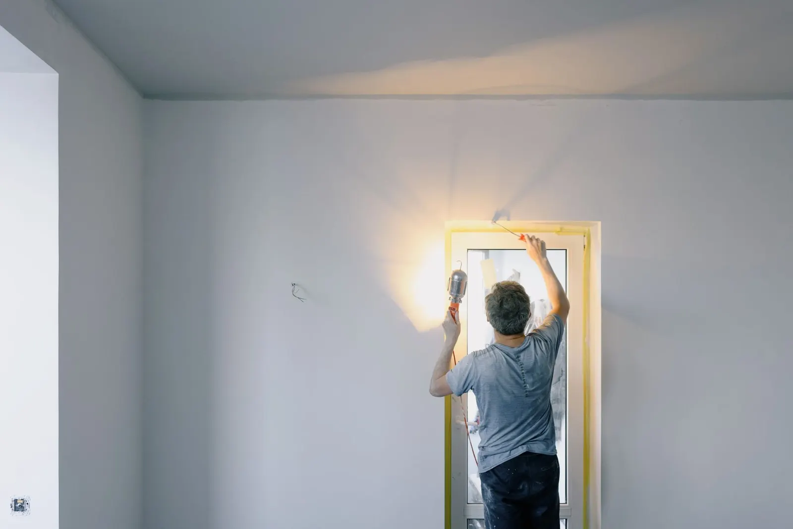 Handyman repairing a door